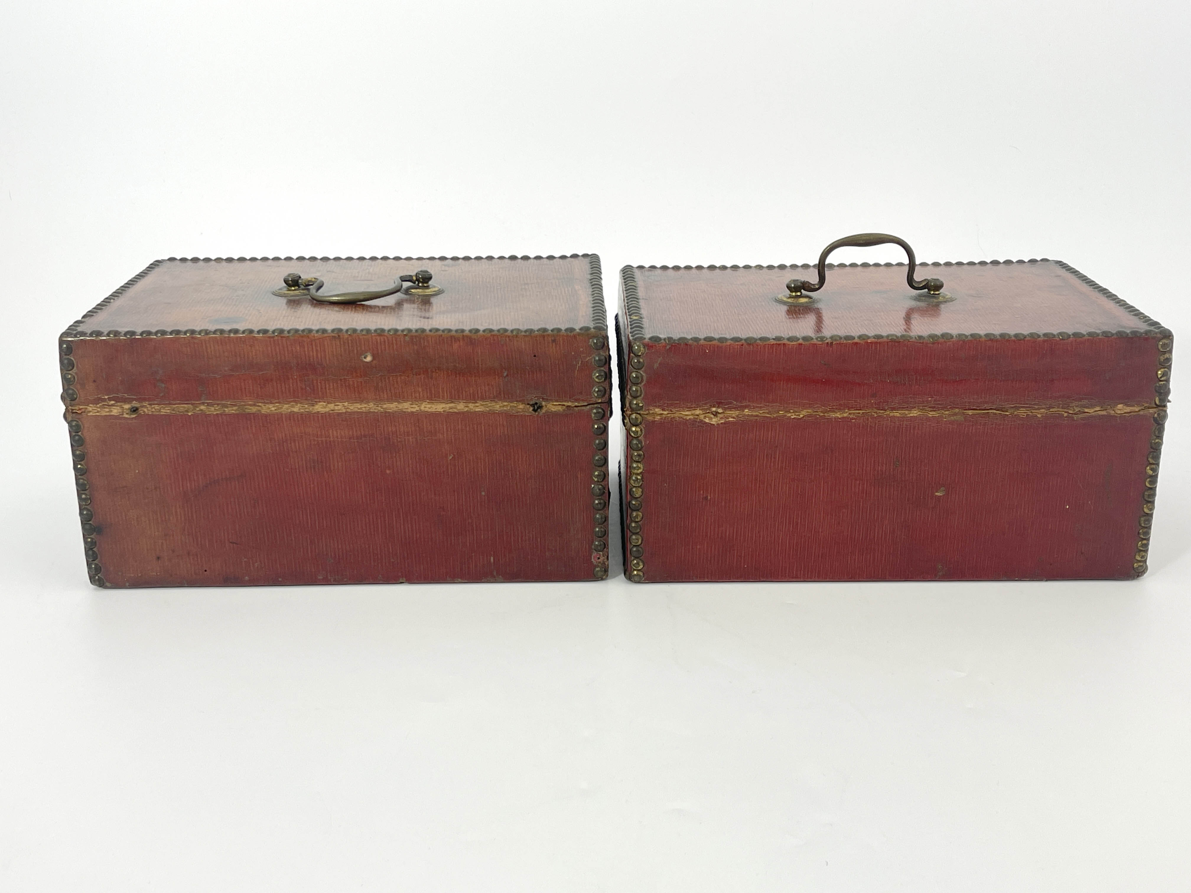 A pair of George III deed boxes, morocco bound with brass studded borders, swing handles to the ring - Image 3 of 4