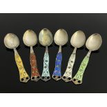A Harlequin set of six Norwegian Arts and Crafts enamelled silver coffee spoons, Aksel Holmsen