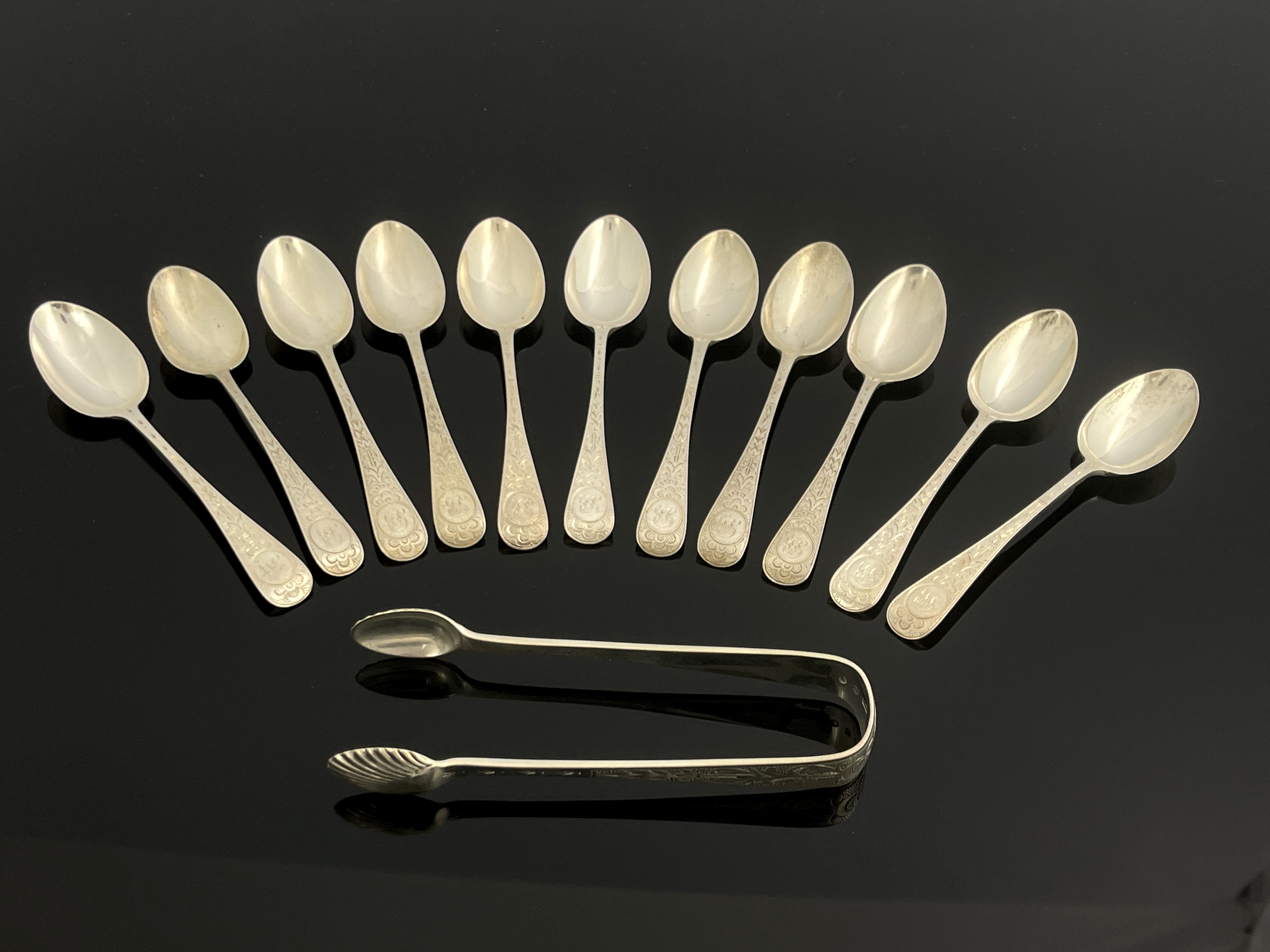 A set of eleven Victorian Scottish silver teaspoons and sugar tongs, Hamilton and Inches, Edinburgh