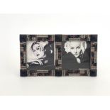 A French Art Deco electroplated and enamelled twin aperture photograph frame, with panelled