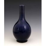 A Chinese blue monochrome glaze bottle vase, 18th century, extended neck, bombe body, celadon
