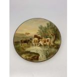 R F Perling for Royal Worcester, a large painted charger, Cows, after Thomas Sidney Cooper,