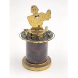 A French Art Deco brass and enamelled cigarette dispenser, with barware including shaker and