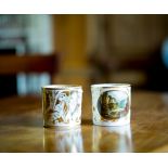 A pair of Derby coffee cans, circa 1810-15, painted with named views, In Dove Dale, Derbyshire and