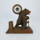 A Black Forest desk barometer, 20th Century, carved as a strolling bear with cub on a naturalistic