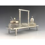 After Christopher Dresser, a silver plated and cut glass cruet