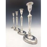 A set of four George V silver candlesticks, Hawksworth, Eyre and Co., Sheffield 1913