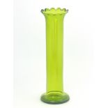 A Bohemian/Austrian green glass vase, cylindrical form with gilt denticulated and flared rim, 40.5cm