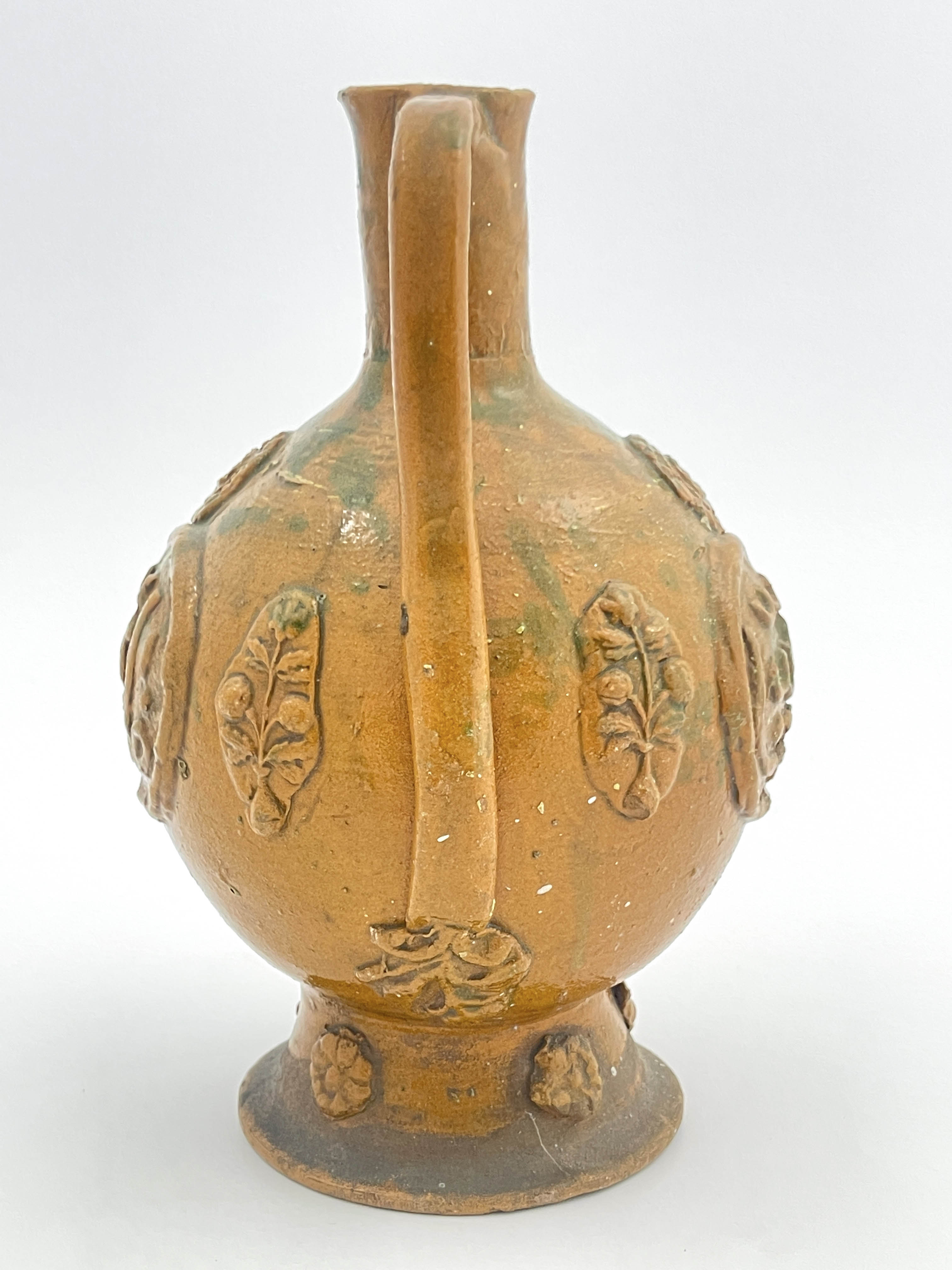 An Islamic stoneware ewer, of ovoid form with handle, sprigged medallions of Islamic script and - Image 5 of 5