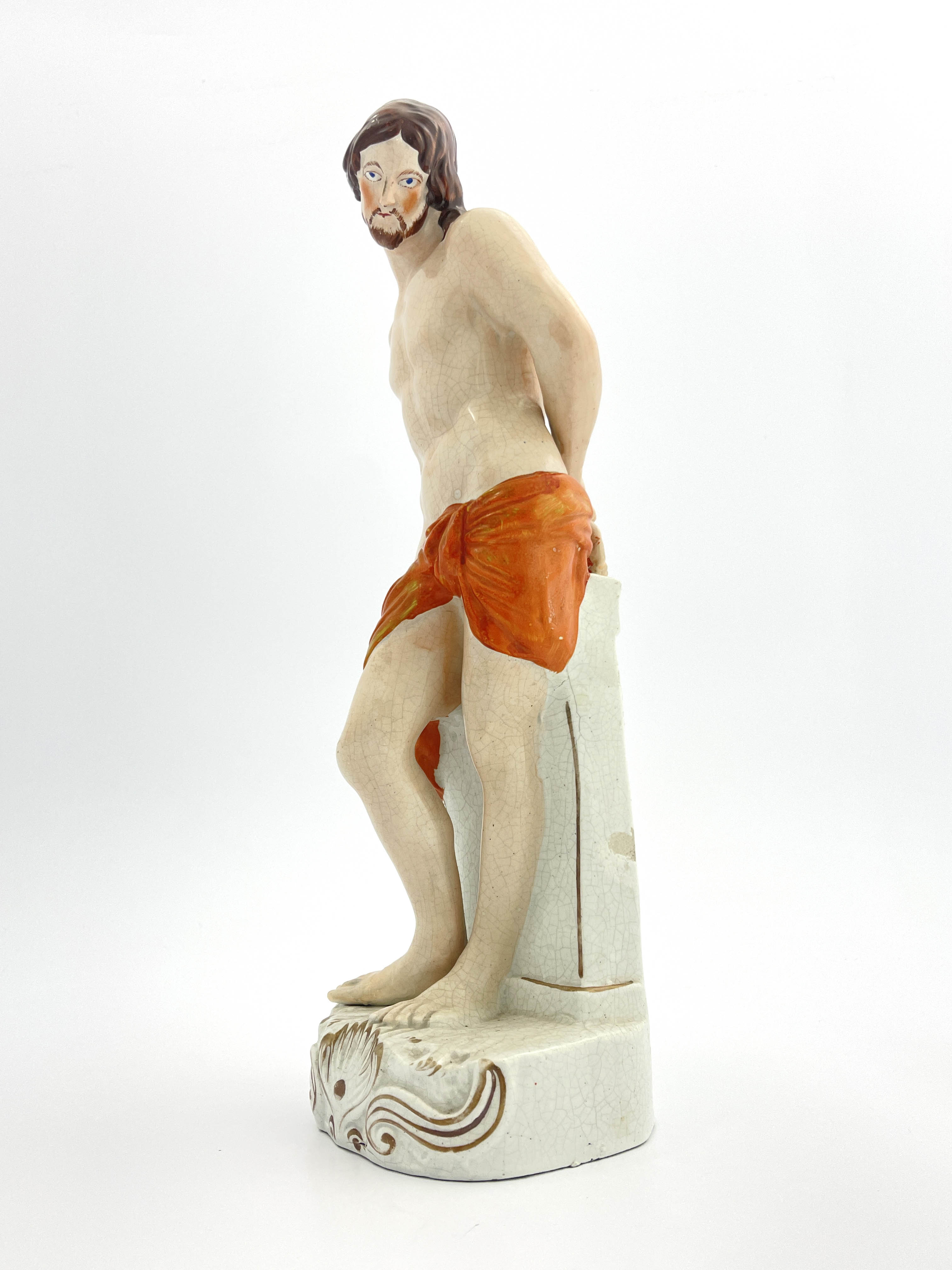 A mid 19th Century Staffordshire pottery figure of Jesus Christ, circa 1860, modelled standing