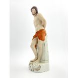 A mid 19th Century Staffordshire pottery figure of Jesus Christ, circa 1860, modelled standing