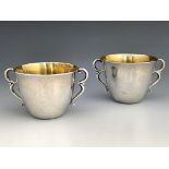 Johan Rohde for Georg Jensen, a pair of Danish Secessionist silver twin handled cups