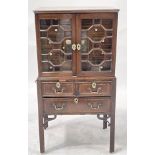 A George III mahogany collectors cabinet on stand, circa 1770 and later, Chinese Chippendale design,