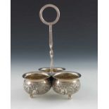 An Edwardian silver cruet stand, Jacob Fenigstein, London 1910, three conjoined cauldron form