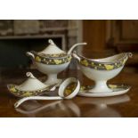 A pair of Davenport creamware tureens, covers and ladles, circa 1810, boat shaped with scroll twin