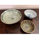 A Chinese provincial blue and white bowl, florally painted, 15cm diameter together with a polychrome