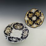 Two early 20th century Meissen Leuteritz rococo relief moulded plates, decorated with fruit and