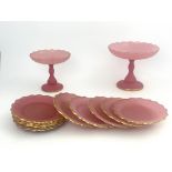 A late 19th Century Bohemian pink glass dessert service, circa 1880, gilt wavy edges, comprising two