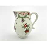 A Lowestoft sparrow beak cream jug, circa 1780, decorated with Curtis style flowers and green swag