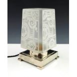 A French Art Deco table lamp with geometric frosted glass shade on chromed circular collar and