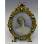 An Art Nouveau portrait miniature in gilt and gem set frame