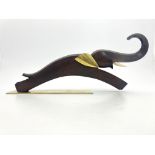 Karl Hagenauer, an Austrian Art Deco carved wood and brass figure of a leaping elephant,