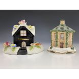 Two 19th Century pastille burners on separate plinths, to include a gabled cottage with gilt front