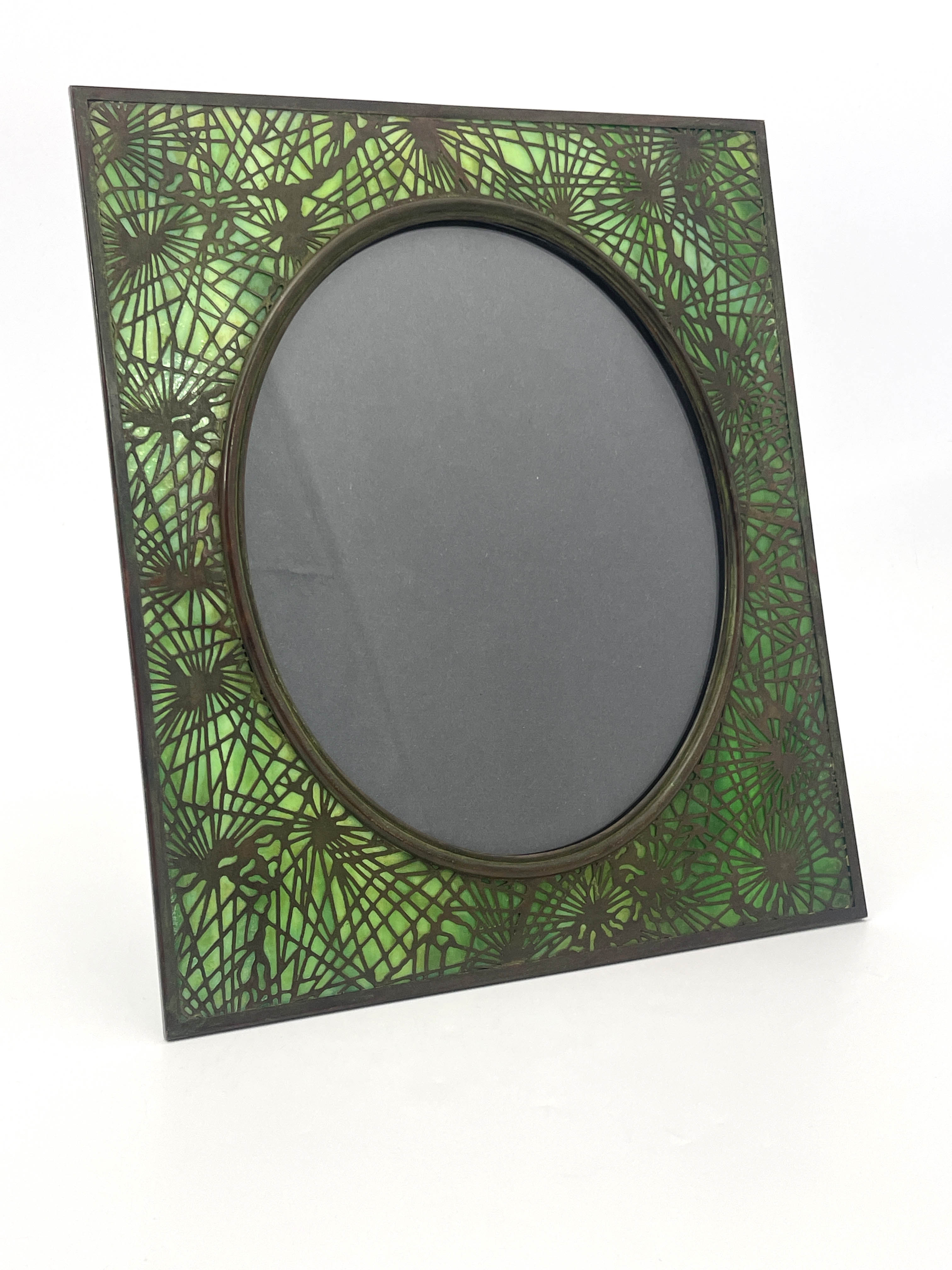 Tiffany Studios, an American Art Nouveau bronze and stained glass photo frame