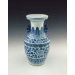A 19th Century Chinese provincial blue and white baluster vase, two-dimensional beast handles, the
