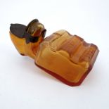 A Patent Fortschritt amber glass inkwell, sheet metal cover, 13cm long