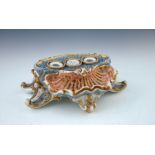A 19th Century Paris porcelain desk inkstand, of Rococo design in the form of a shell on a raised