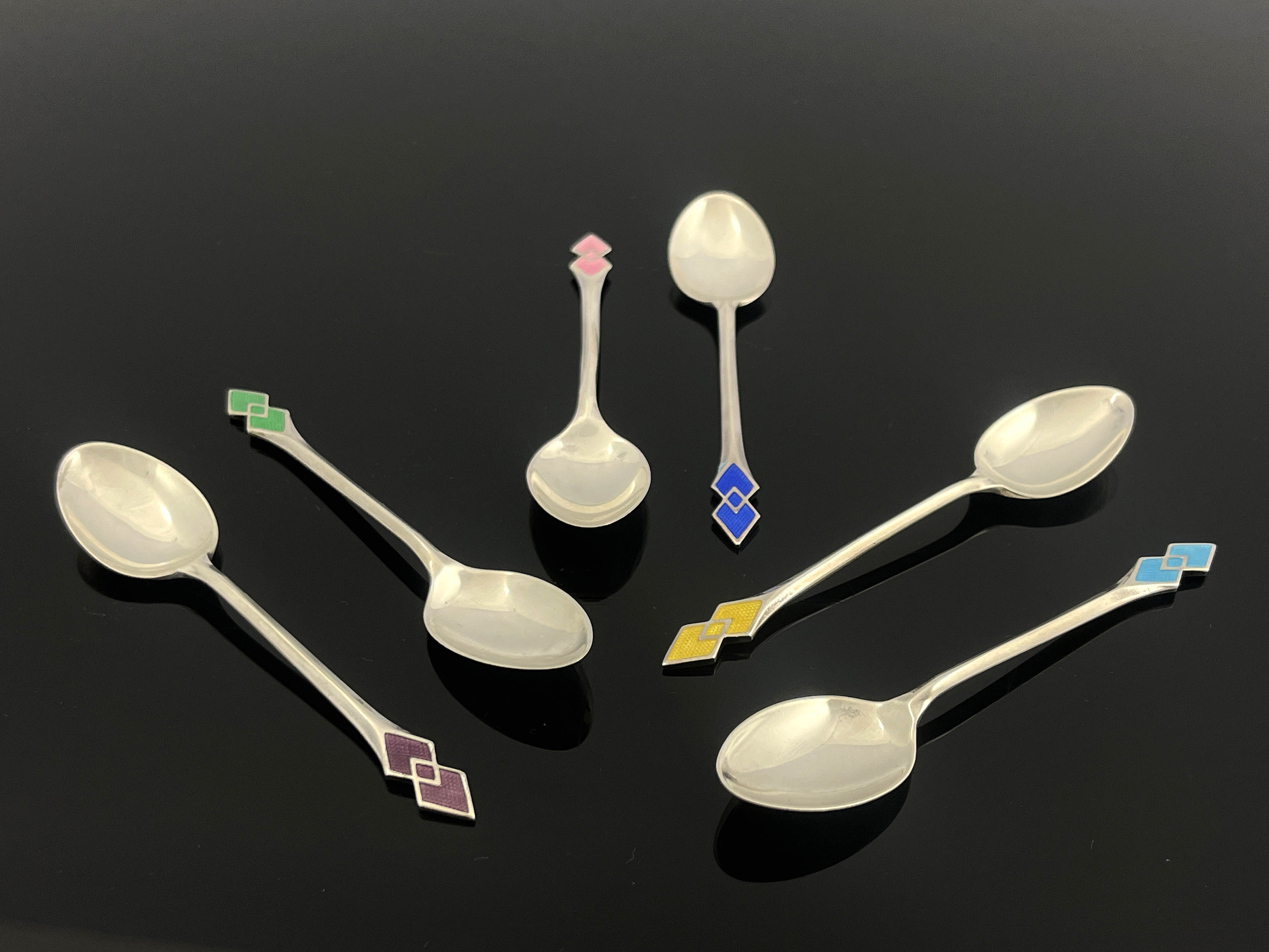 A set of six George VI Art Deco silver teaspoons, Turner & Simpson Ltd, Birmingham 1938, coloured