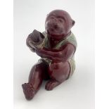 Bernard Moore, a flambe lustre figure of a monkey