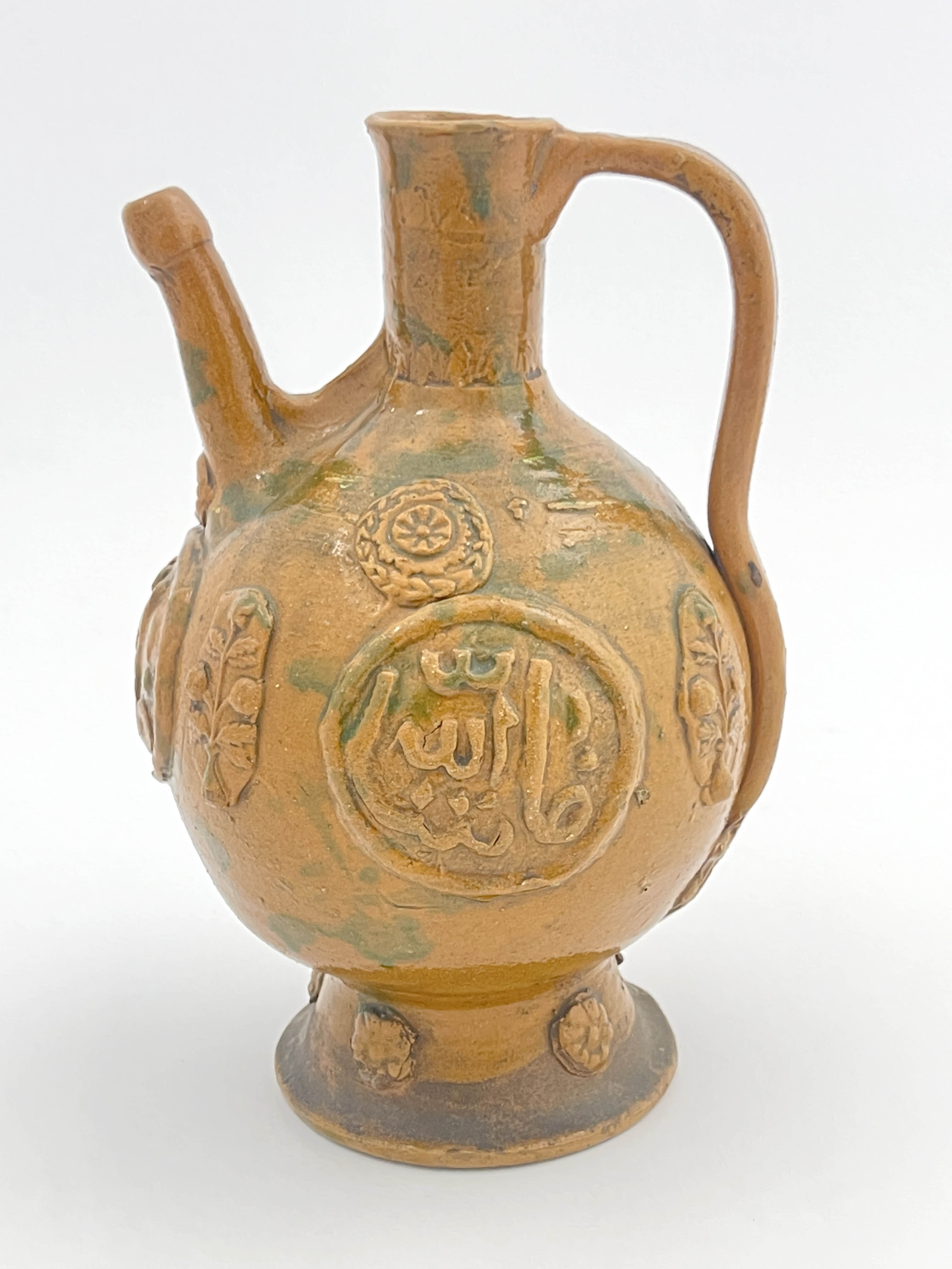 An Islamic stoneware ewer, of ovoid form with handle, sprigged medallions of Islamic script and - Image 4 of 5