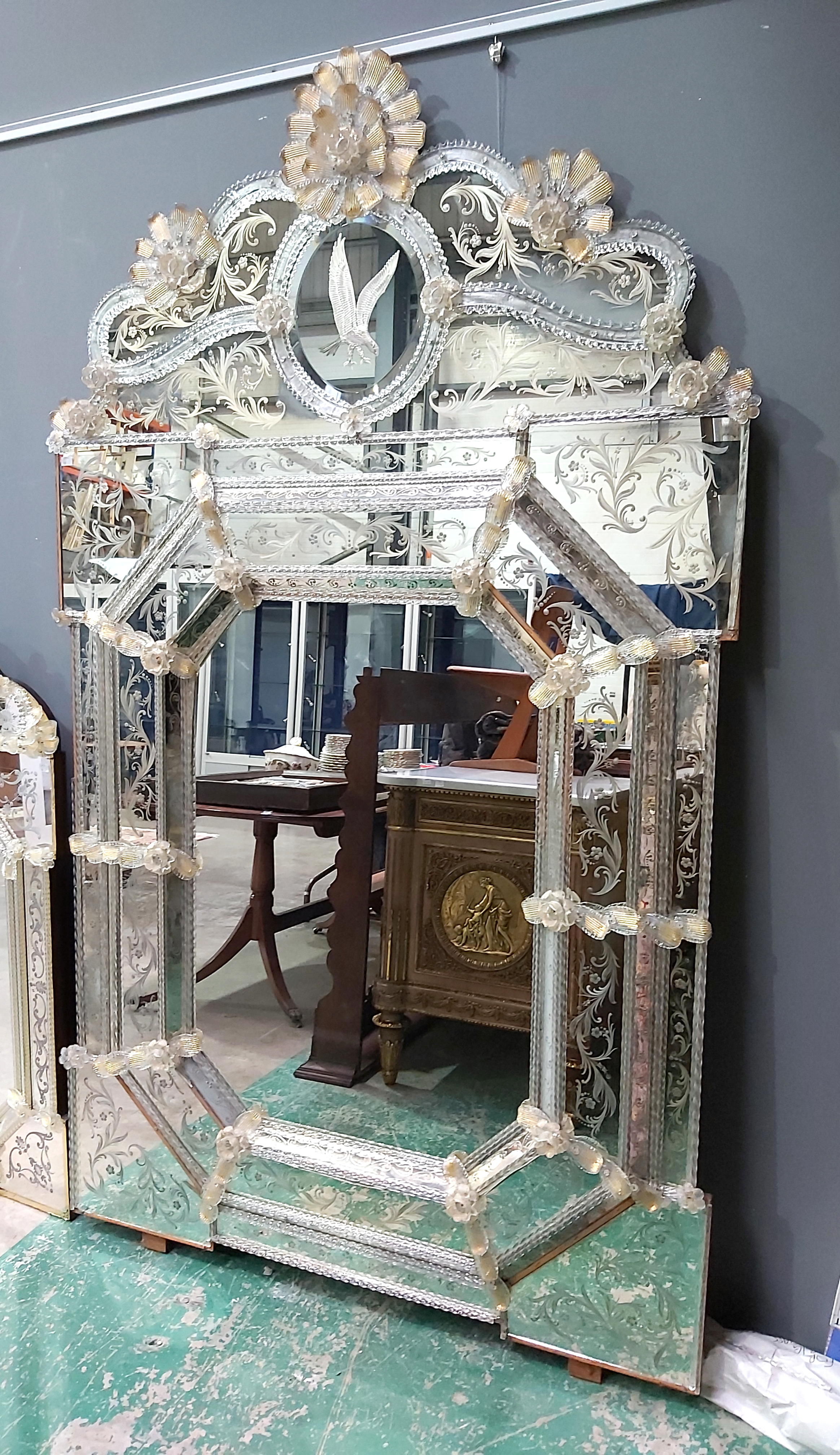 A large Venetian design wall mirror, 20th Century, gilt pincered glass floral embellishments