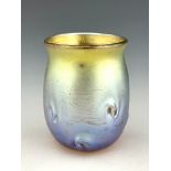 Louis Comfort Tiffany, an Art Nouveau iridescent glass miniature vase