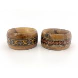 A pair of Victorian Sorrento Ware napkin rings, each of carved olive wood with tessellated mosaic