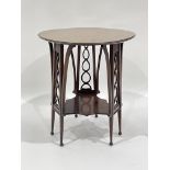 An Edwardian mahogany Art Nouveau occasional table, circa 1905, circular marquetry inlaid top,