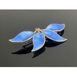 Willy Winnaess for David Andersen, a Norwegian Modernist silver gilt and enamel four leaf brooch