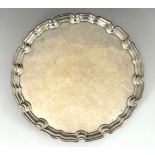 A George VI silver salver, Stower & Wragg Ltd, Sheffield 1943, Bath edge, triple scroll feet, 29.