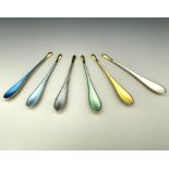 A harlequin set of six Danish Modernist silver gilt and enamelled coffee spoons or lobster picks