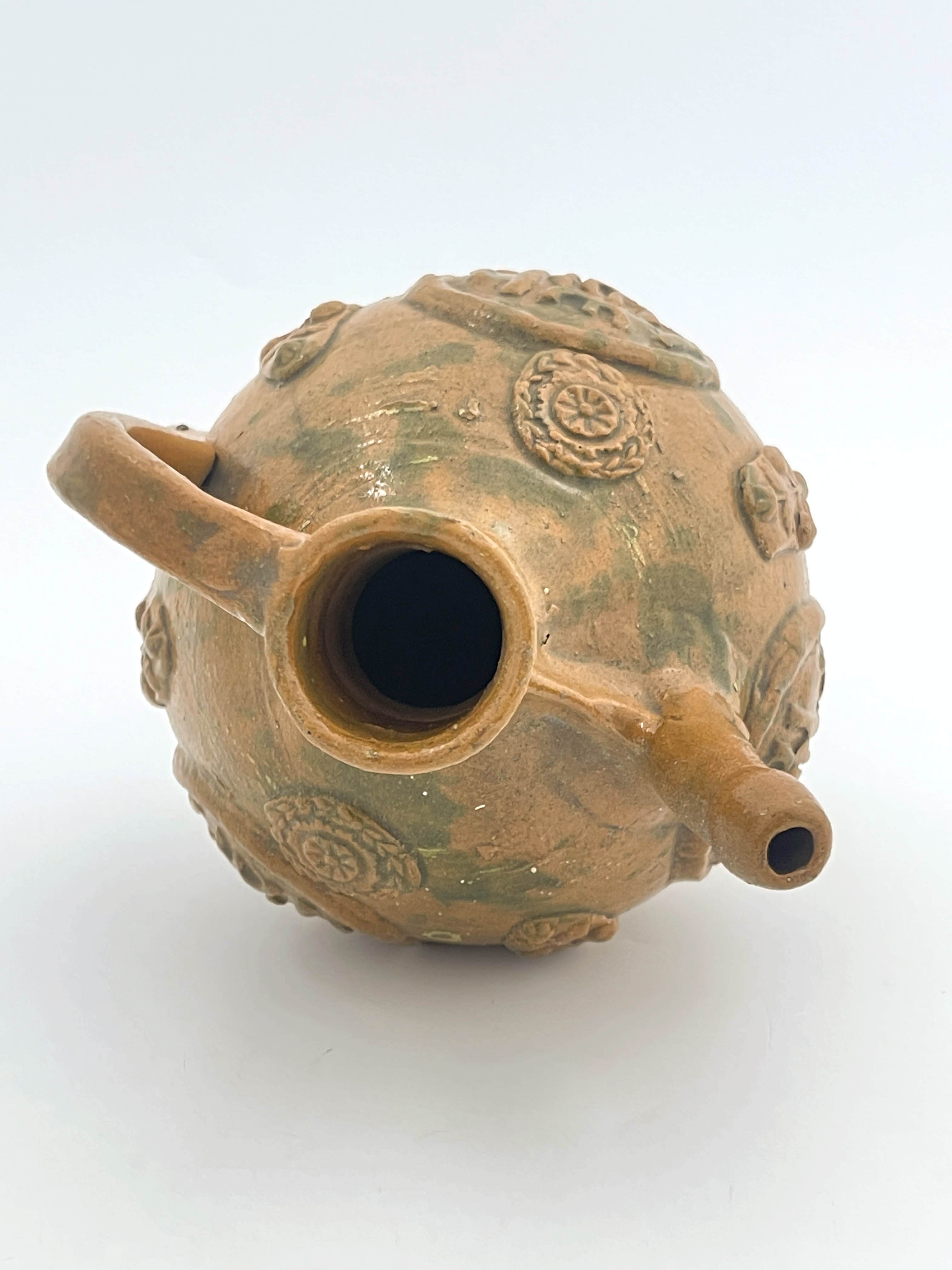 An Islamic stoneware ewer, of ovoid form with handle, sprigged medallions of Islamic script and - Image 2 of 5