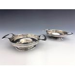 Oliver Baker for Liberty and Co., a pair of Arts and Crafts silver twin handled dishes