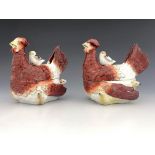 A pair late 19th Century Staffordshire pottery hen boxes and covers, surmounted and the bases with