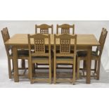 A contemporary light oak dining suite, comprising rectangular dining table and six dining chairs,