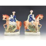 A pair of 19th Century Staffordshire flatback figures, gentleman and female companion astride on