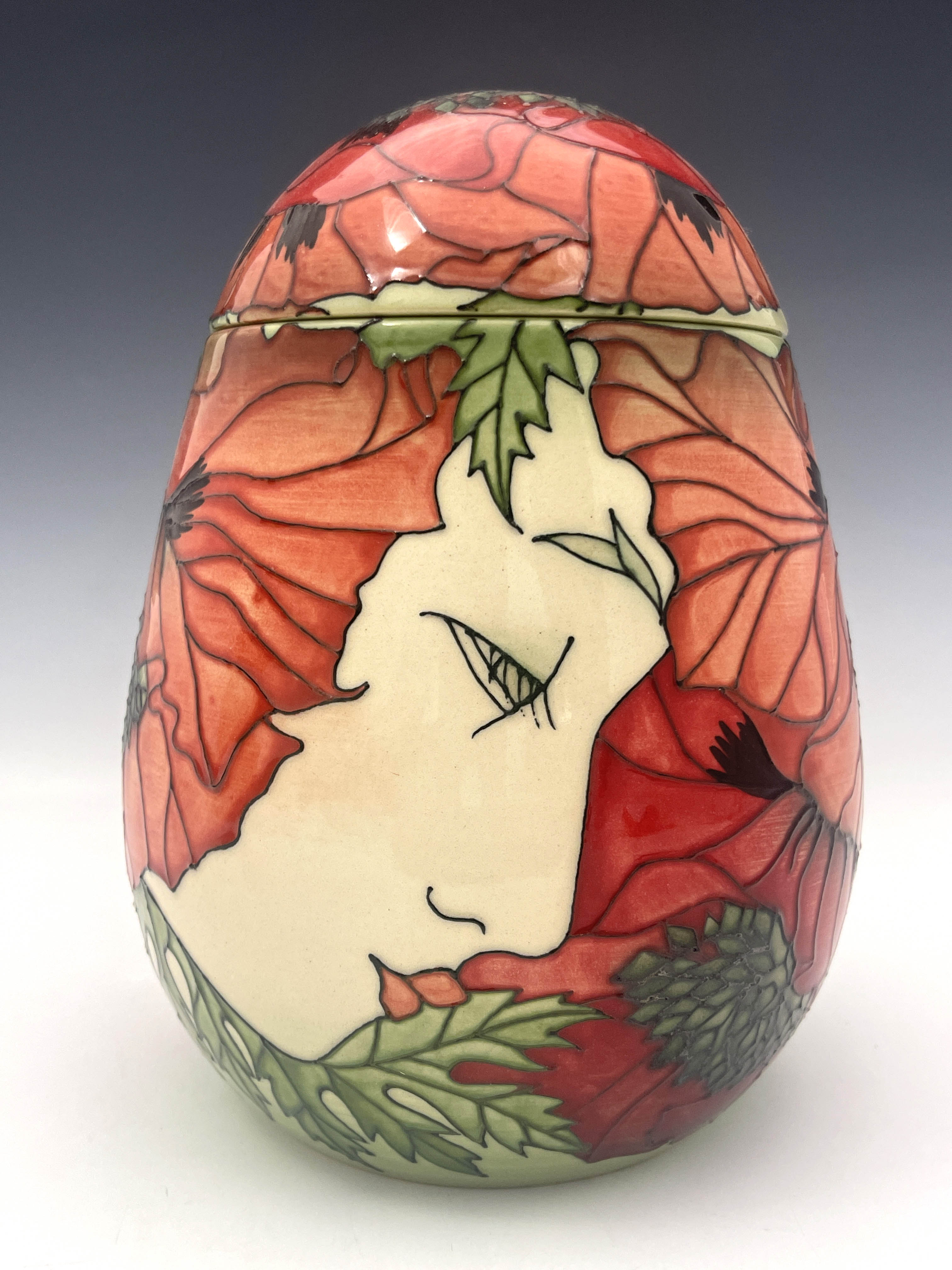 Sally Tuffin for Dennis China works, a head and poppy vase and cover, ovoid form, 21cm high