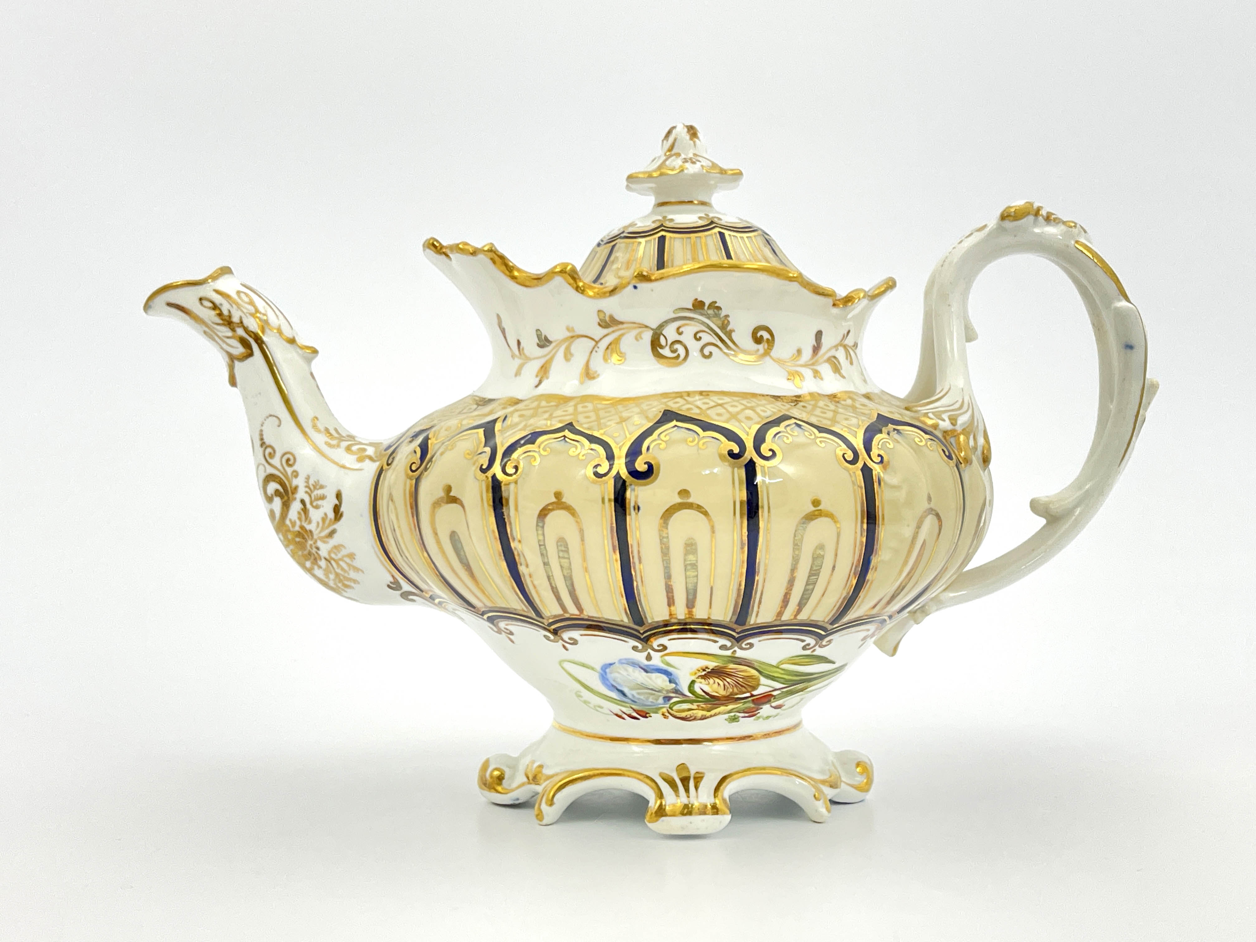 An English bone china teapot and cover, circa 1840, of Rococo design with gilt and blue ogee cover - Image 2 of 8