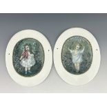 A pair of 19th century oval Prattware wall plaques