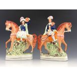 A pair of 19th Century Staffordshire flatback figure groups, Scottish bagpipe player and female